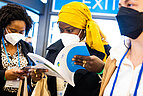Participants looking at the written program