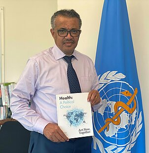 Tedros Adhanom Ghebreyesus with a copy of "Health: A Political Choice"